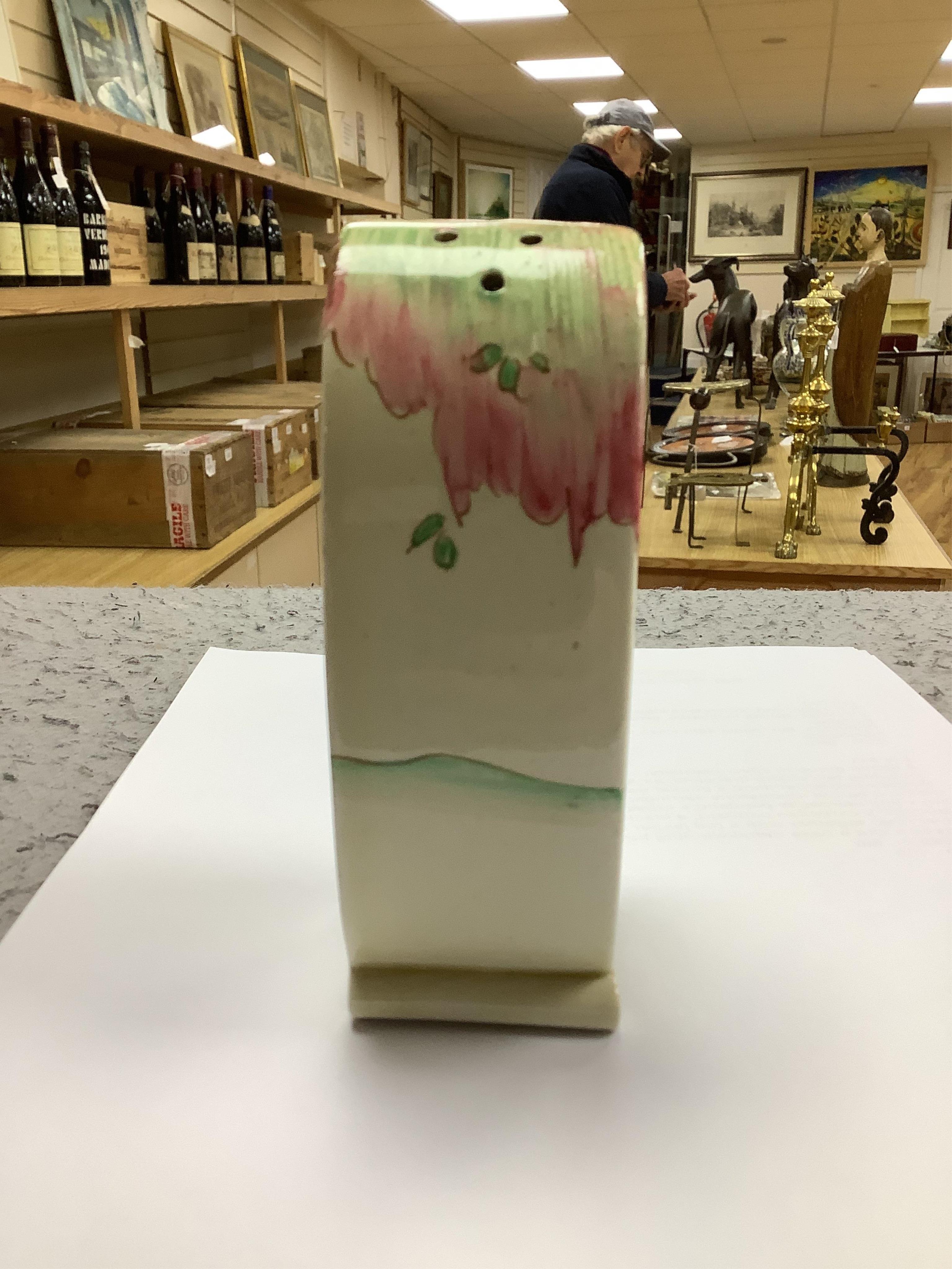A Clarice Cliff Bonjour shaped sugar sifter, 12.5cm high. Condition - good